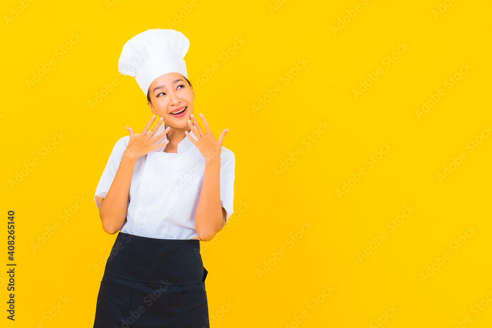 Portrait beautiful young asian woman in chef or cook uniform with hat Portrait beautiful young asian woman in chef or cook uniform with hat