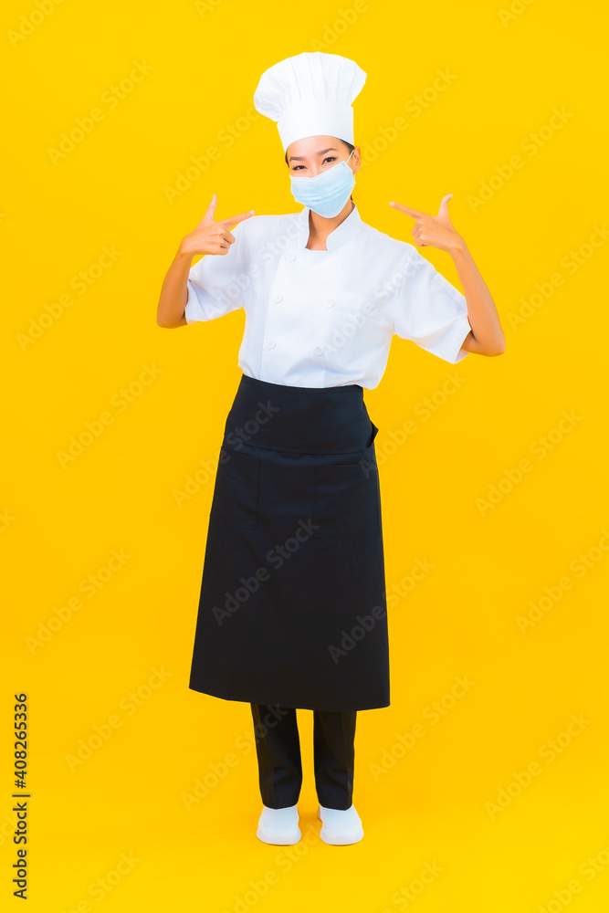 Portrait beautiful young asian woman chef wear mask for protect covid19 or coronavirus Portrait beautiful young asian woman chef wear mask for protect covid19 or coronavirus