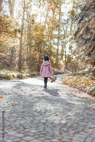 child walking in the woods
