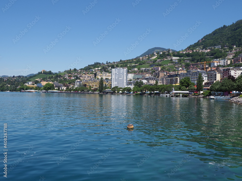 Marvelous Lake Geneva and european Montreux city in canton Vaud in Switzerland, clear blue sky in 2017 warm sunny summer day on July.