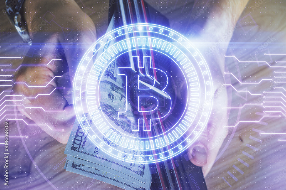 Multi exposure of blockchain theme drawing hologram and USA dollars bills and man hands. Business concept. Multi exposure of blockchain theme drawing hologram and USA dollars bills and man hands. Business concept.