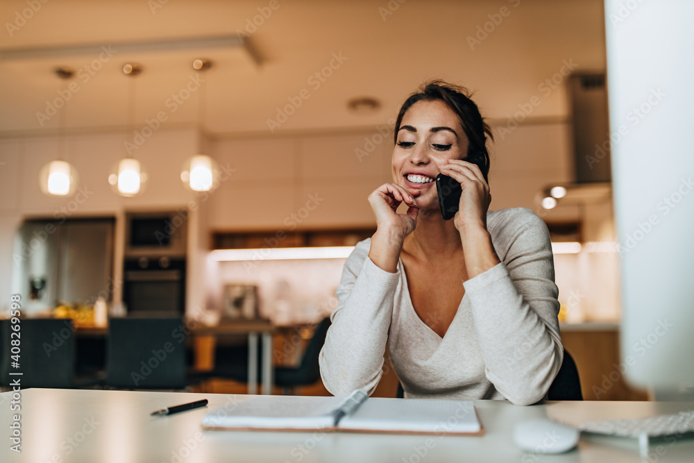 Using modern technology, and writing her notebook. Using modern technology, and writing her notebook.