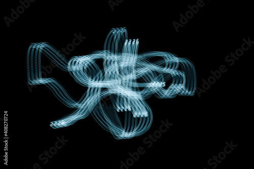 An abstraction. Numbers in motion. Turquoise on a black background. Dark background.