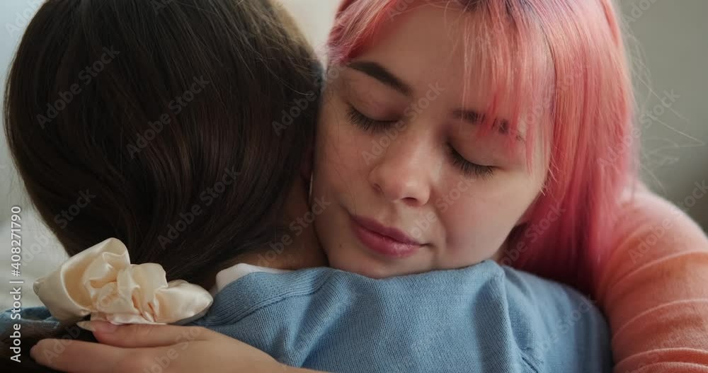 Loving lesbian couple embracing at home Loving lesbian couple embracing at home