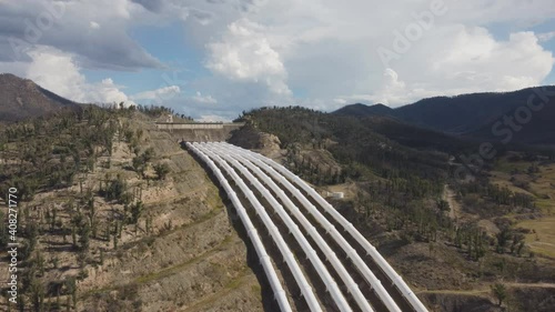 aerial approaching clip of talbingo power station inlet and pipes in nsw, australia photo