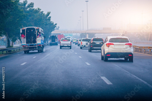 Car parked on road and Small passenger car seat on the road used for daily trips