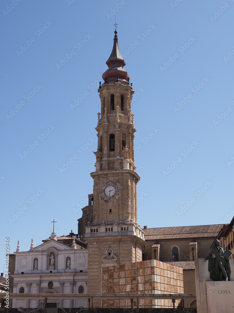 Scenic cathedral of the Savior in Saragossa city in Spain on main market square in european city at Aragon district, clear blue sky in 2019 warm sunny summer day on September - vertical.