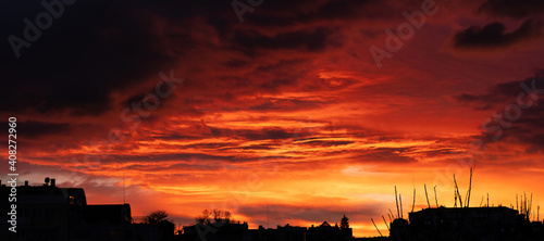 Beautiful sunset over the village. Fluffy clouds. 