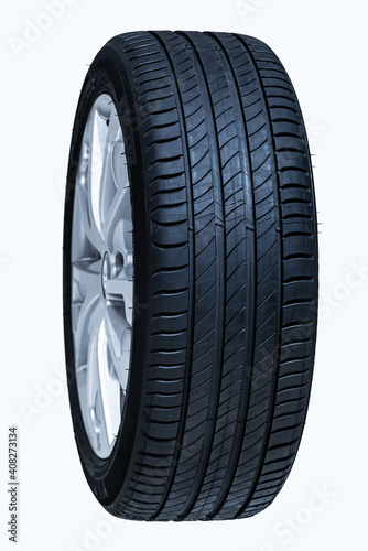 Car wheel isolated on a white background. Blue toned.