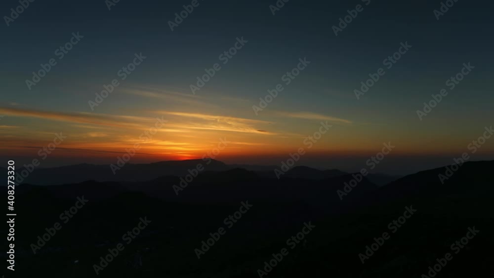 Time-lapse of sunrise, continuous mountains in the morning Time-lapse of sunrise, continuous mountains in the morning