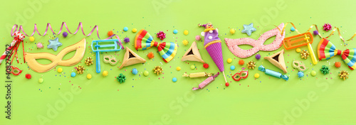 Purim celebration concept  jewish carnival holiday  over wooden green background. Top view  flat lay