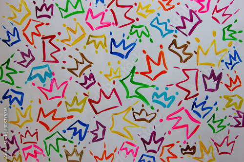 Pattern of colored painted crowns from watercolor paints and gouache