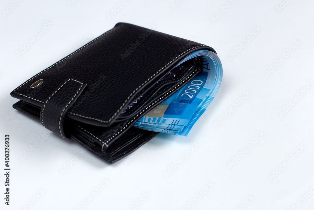 New Black leather wallet with banknotes isolated on white background. Rich life conceptual background New Black leather wallet with banknotes isolated on white background. Rich life conceptual background