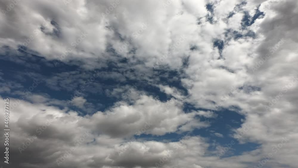 Large cumulus clouds in the blue summer sky. Timelapse. Cloudy sky as background.
Large cumulus clouds in the blue summer sky. Timelapse. Cloudy sky as background.