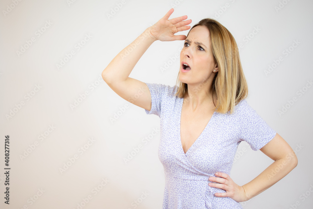 Portrait of a pensive casual woman looking away at copy space isolated over white background Portrait of a pensive casual woman looking away at copy space isolated over white background