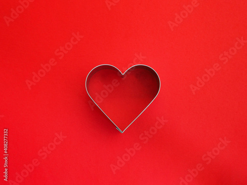 Close up heart shape on red color background.