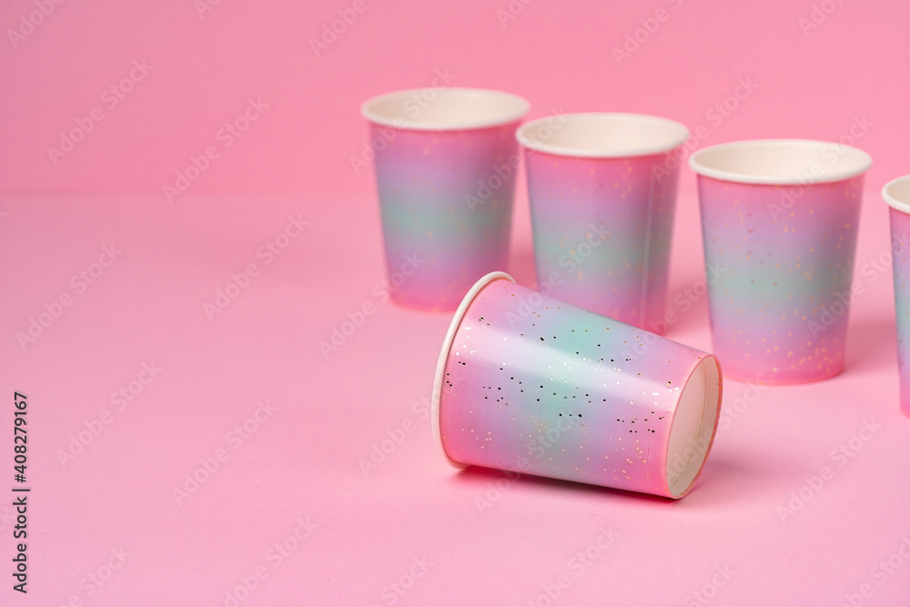 Pink disposable paper cups on pink background Pink disposable paper cups on pink background