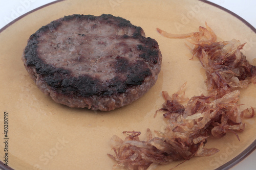 homemade burger grillet without bread and with fried onions photo