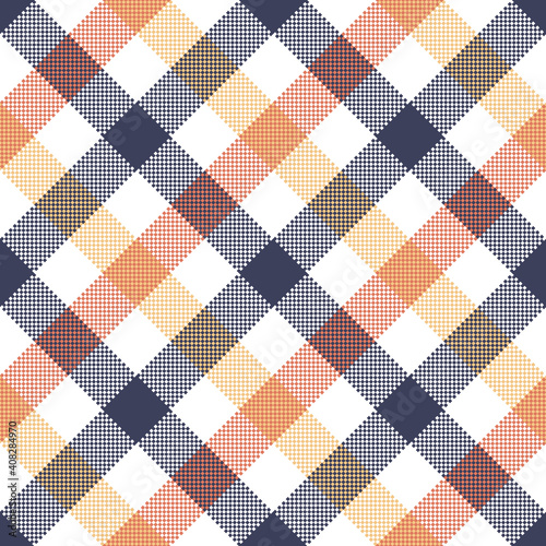 Gingham textile pattern in blue, orange, yellow, white. Seamless multicolored diagonal pixel check plaid for dress, skirt, shirt, tablecloth, or other modern textile print.