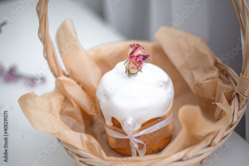 Traditional russian easter cake on table. The decorarion of kulich are the flower photo