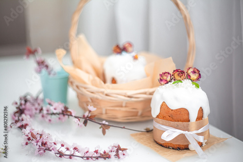 Traditional russian easter cake on table. The decorarion of kulich are the flower are eating on spring holiday photo