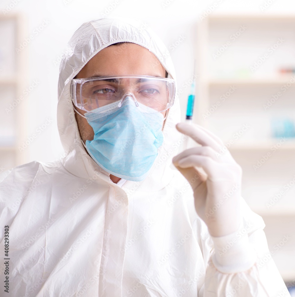 Young chemist student working in lab on chemicals