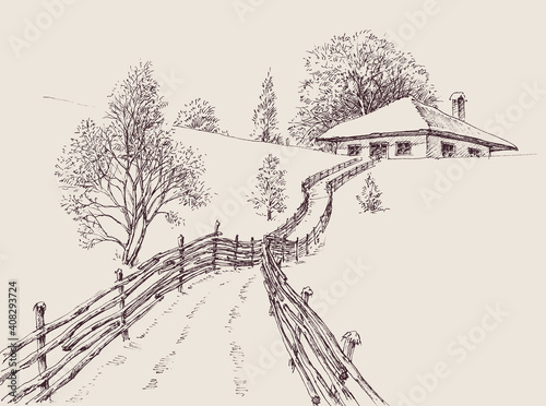 Winter landscape with a house and forest. A road to the house in a wintry landscape