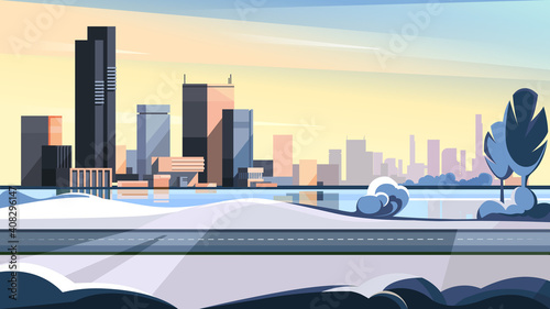 Winter cityscape with road and lake. Beautiful urban scene.
