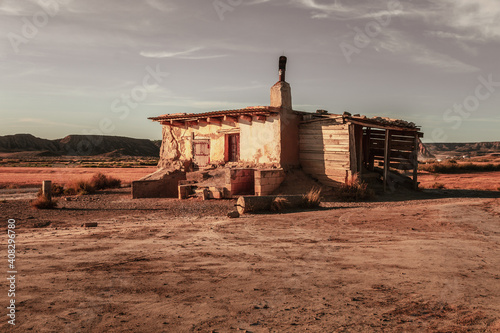 Abandoned house in Bardenas Reales desert in Navarra, Spain, captured during sunset. photo