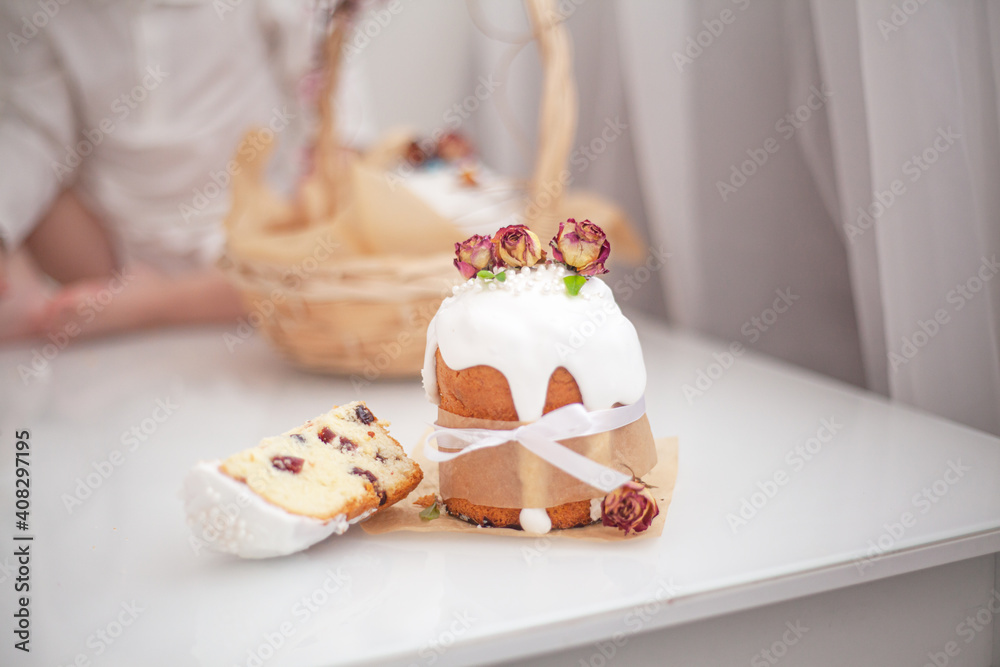 Traditional russian easter bread on table. The decorarion of kulich are the flower are eating on spring holiday Traditional russian easter bread on table. The decorarion of kulich are the flower are eating on spring holiday