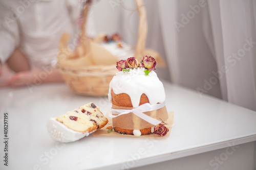 Traditional russian easter bread on table. The decorarion of kulich are the flower are eating on spring holiday