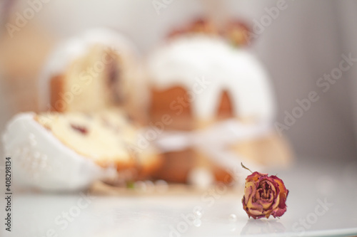 Traditional russian easter bread on table. The decorarion of kulich are the flower are eating on spring holiday photo