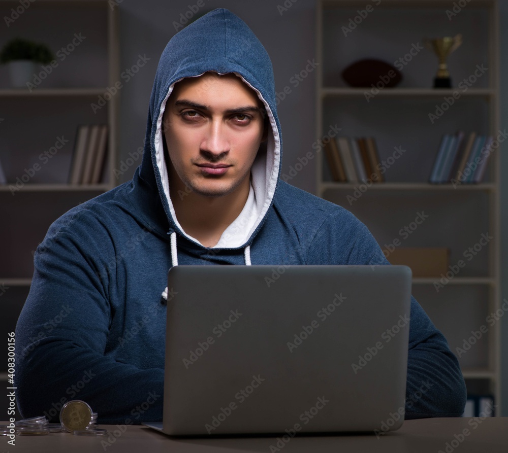 Hacker hacking the data late at night Hacker hacking the data late at night