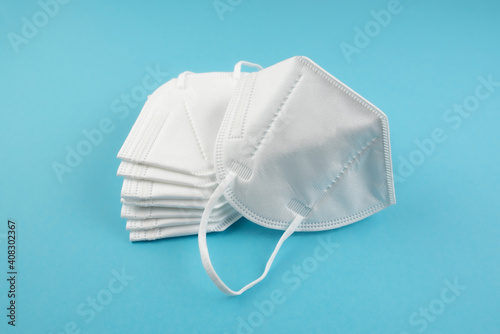 Canvastavla stack of FFP2 or N95 respirator face masks on blue background