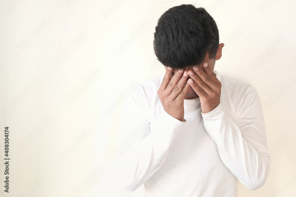 Young man suffering headache, close up Young man suffering headache, close up