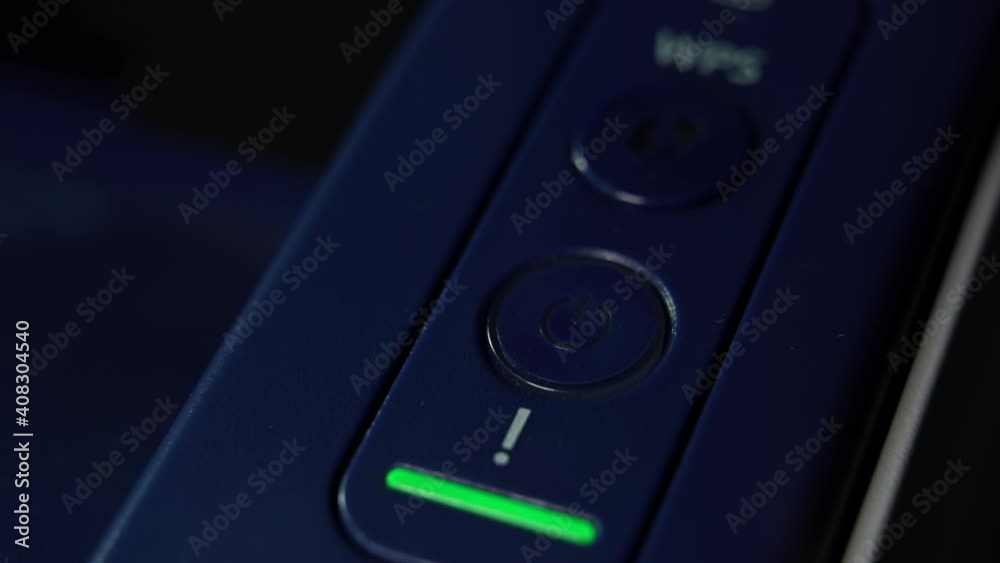 On Off button green light glowing pulsing, Start sign, close up printer panel On Off button green light glowing pulsing, Start sign, close up printer panel