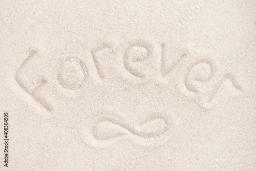 Word Forever writing on sand background above view for wedding romantic invitation or love story