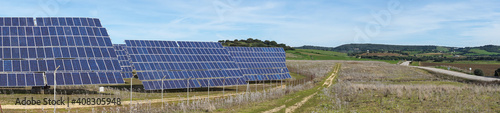 panorama view of many large solar energy panels in the countryside of Andalusia
