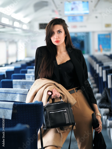 Woman model in train in suit