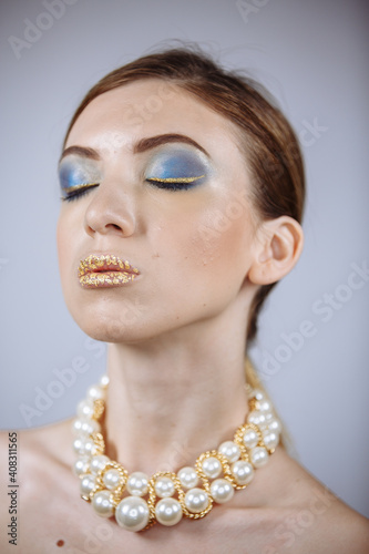 portrait of a girl with closed eyes on a white background