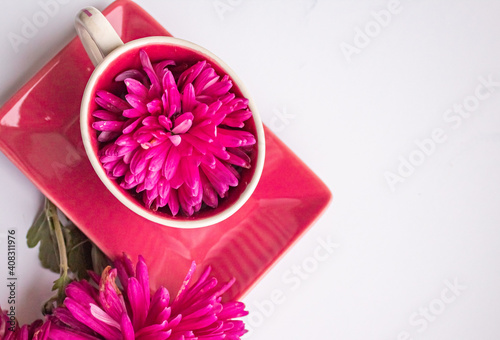 A service of pink utensils with a striped design with pink flowers