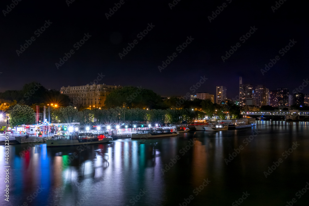 Pleasure Ships at the Night Embankment of the Seine