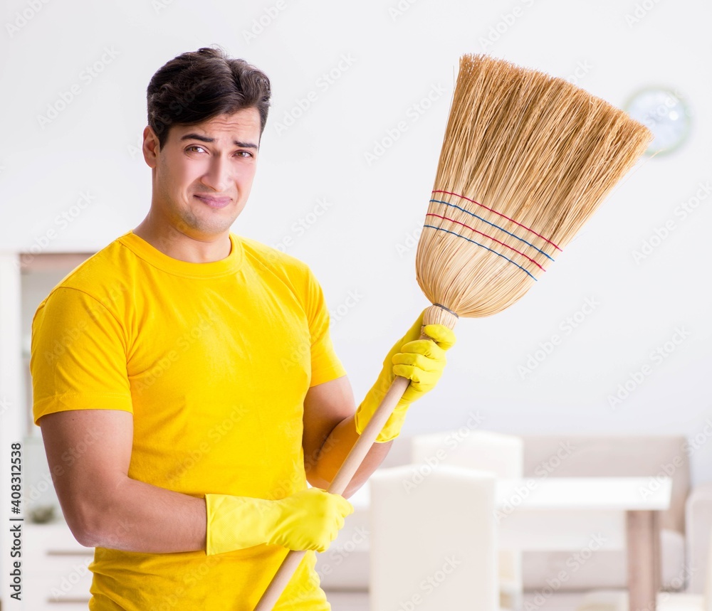 Man husband cleaning the house helping his wife Man husband cleaning the house helping his wife