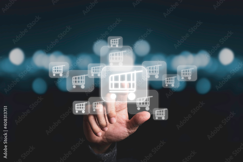 Businessman touching virtual shopping cart trolley with blue bokeh background, Online shopping concept. Businessman touching virtual shopping cart trolley with blue bokeh background, Online shopping concept.