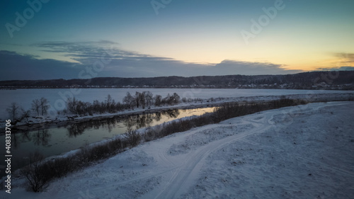 Beautiful winter landscape, sunset over the Dnipro river, view from the drone