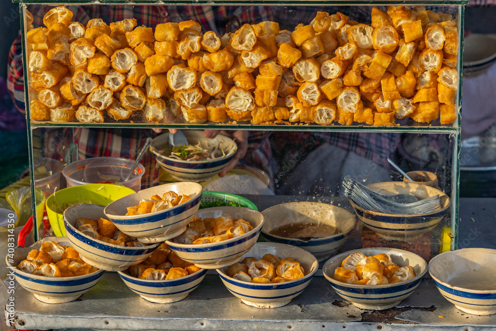 Beautiful photo of a deep-fried bread doughs at streetfood vendor 