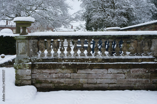 stone balustrade wall after a heavy snow fall