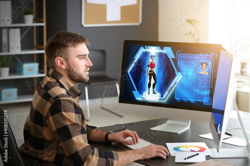 Male video games designer working in studio