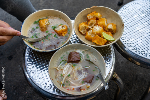 Photography Chao Long - Vietnamese bloodcake porridge served with fried bread sticks