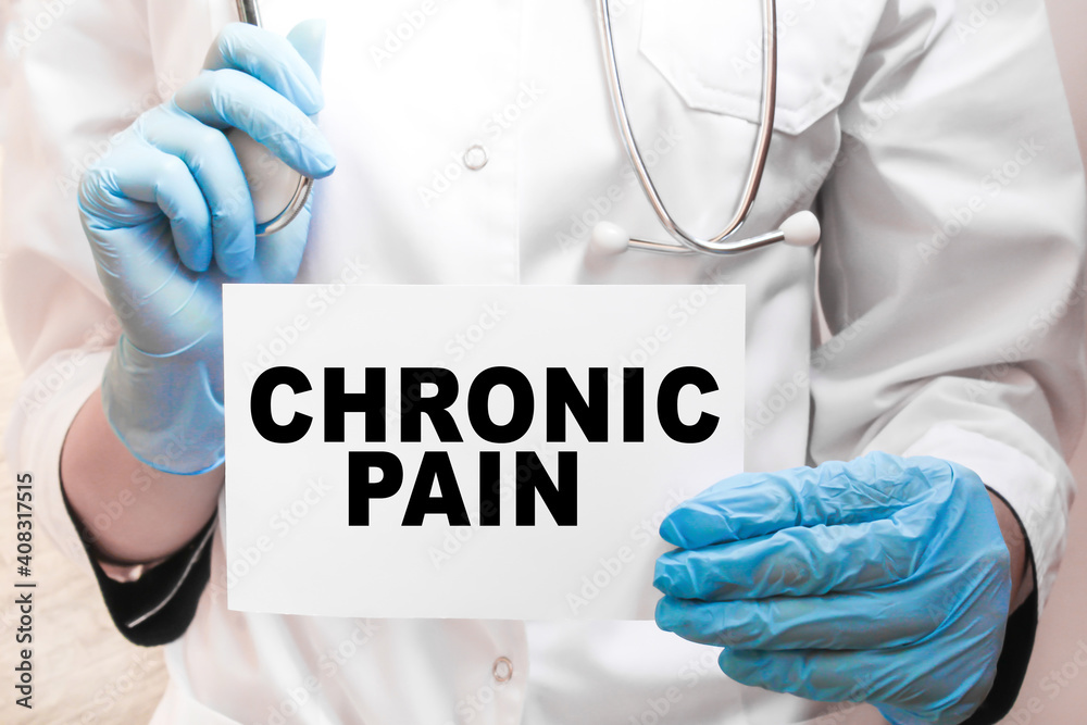 The doctor's blue - gloved hands show the word CHRONIC PAIN - . a gloved hand on a white background. Medical concept. the medicine The doctor's blue - gloved hands show the word CHRONIC PAIN - . a gloved hand on a white background. Medical concept. the medicine